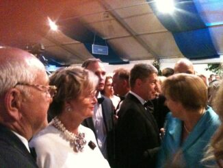 Angela Merkel en Joachim Sauer tijdens de Bayreuther Festspiele in Bayreuth in 2015